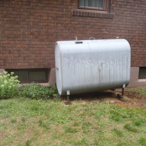 Metal tank outside of building